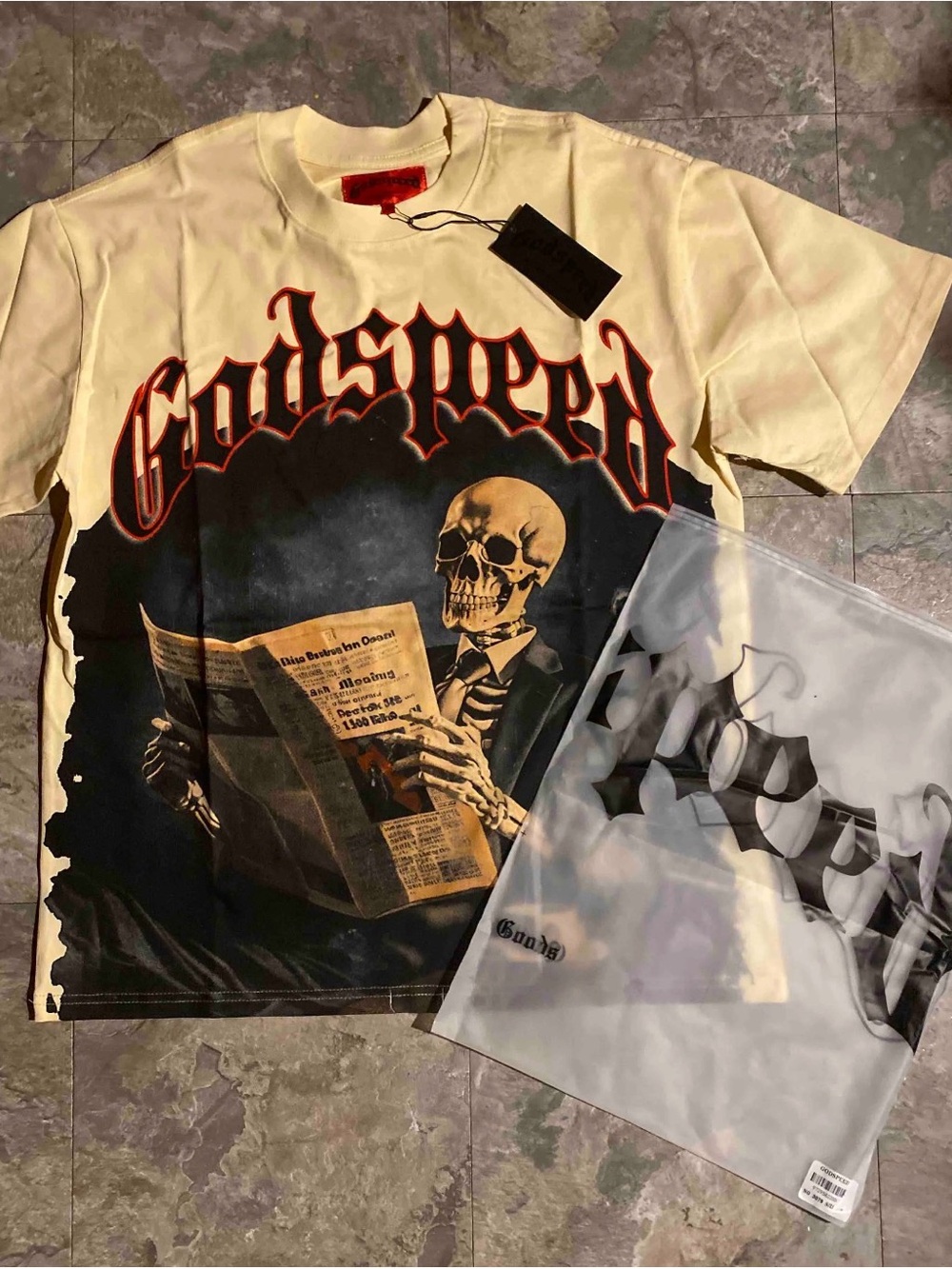 Godspeed Cream Long Sleeve Graphic Tee - Skeleton Newspaper Print